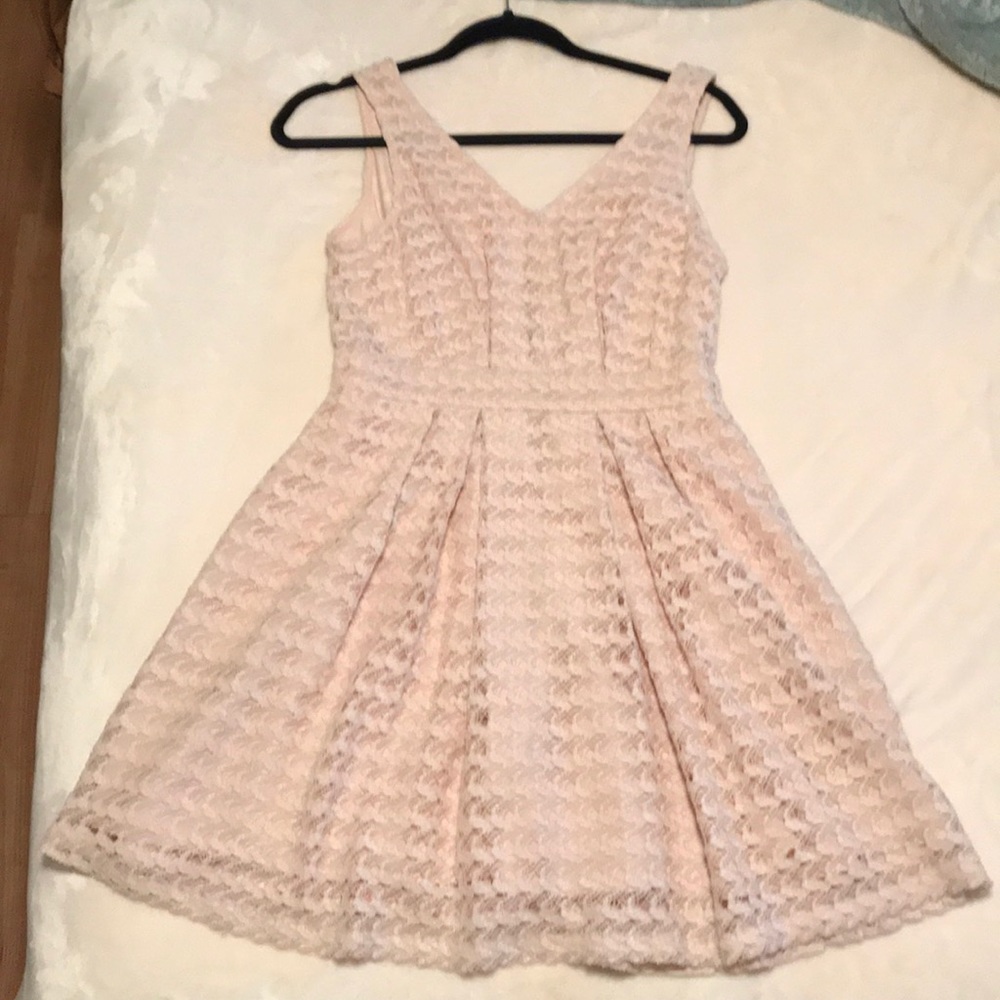 Cream lace dress with low back.